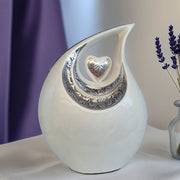 SOULURNS Cream Teardrop Cremation Urn – Silver Heart Embossed Memorial Urn for Ashes